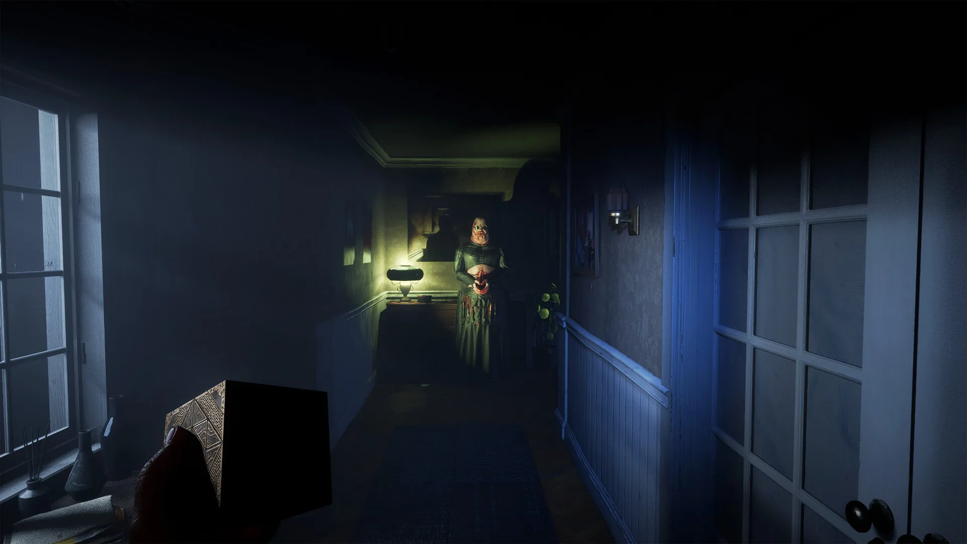 Steam screenshot of a dim hallway with windows and a door in Hellraiser: Revival, 1920 by 1080, Steam app 1551980